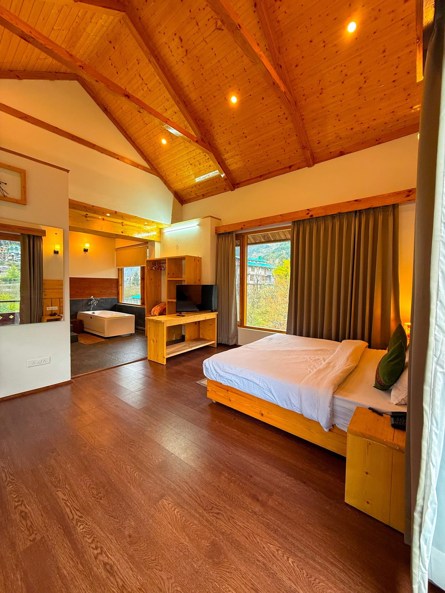 The attic suite — bath and bed under the pitched roof