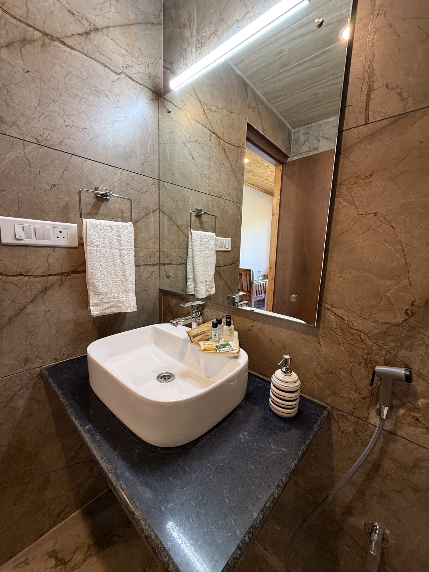 Stone bathroom with rain shower