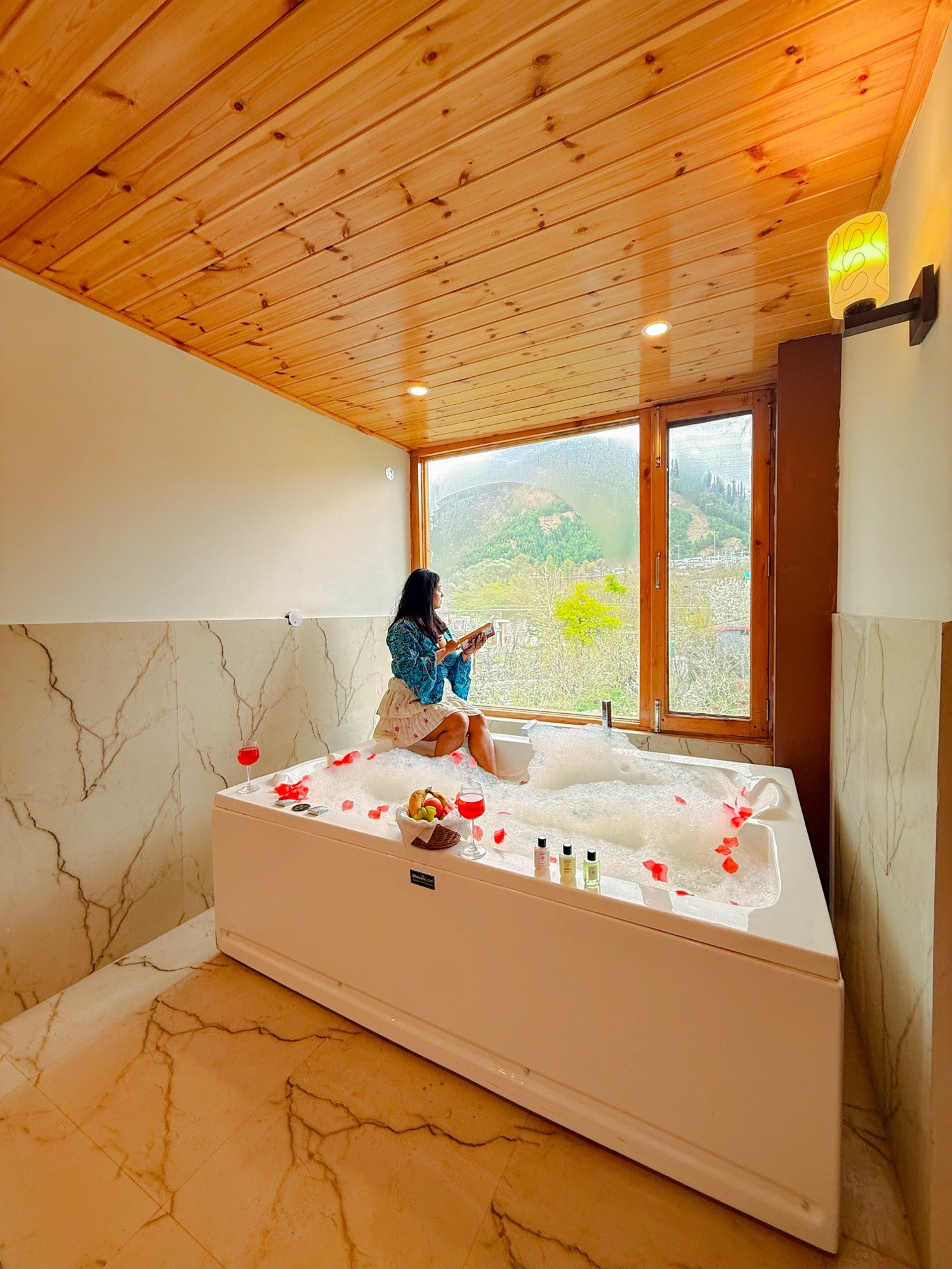 A guest in the bathtub suite