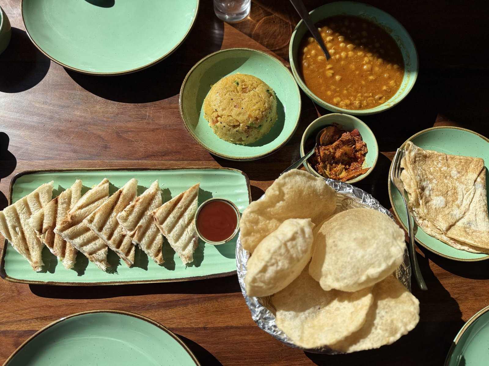 Breakfast — parathas, poori, and curry
