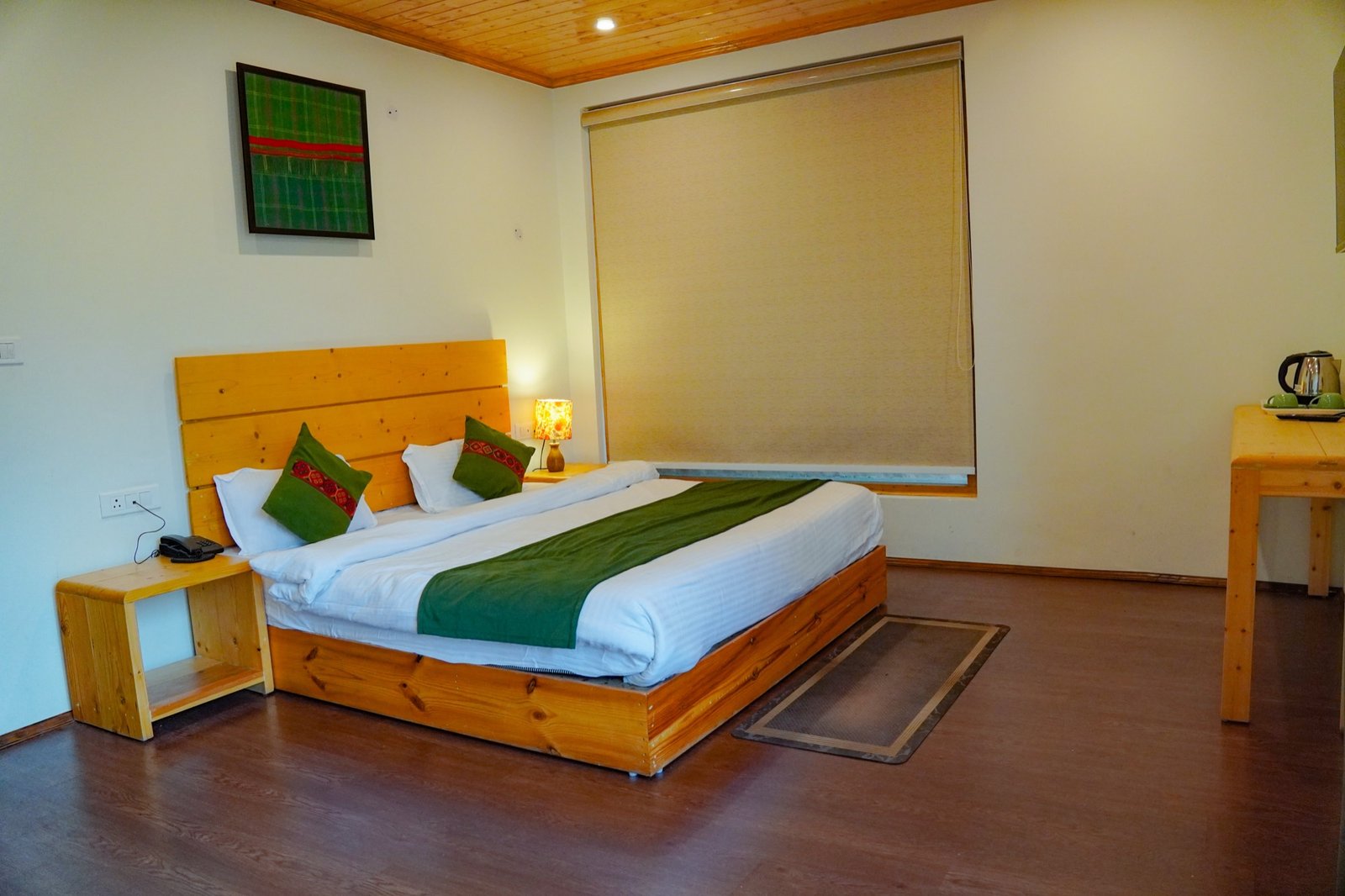 Deluxe room with pine headboard