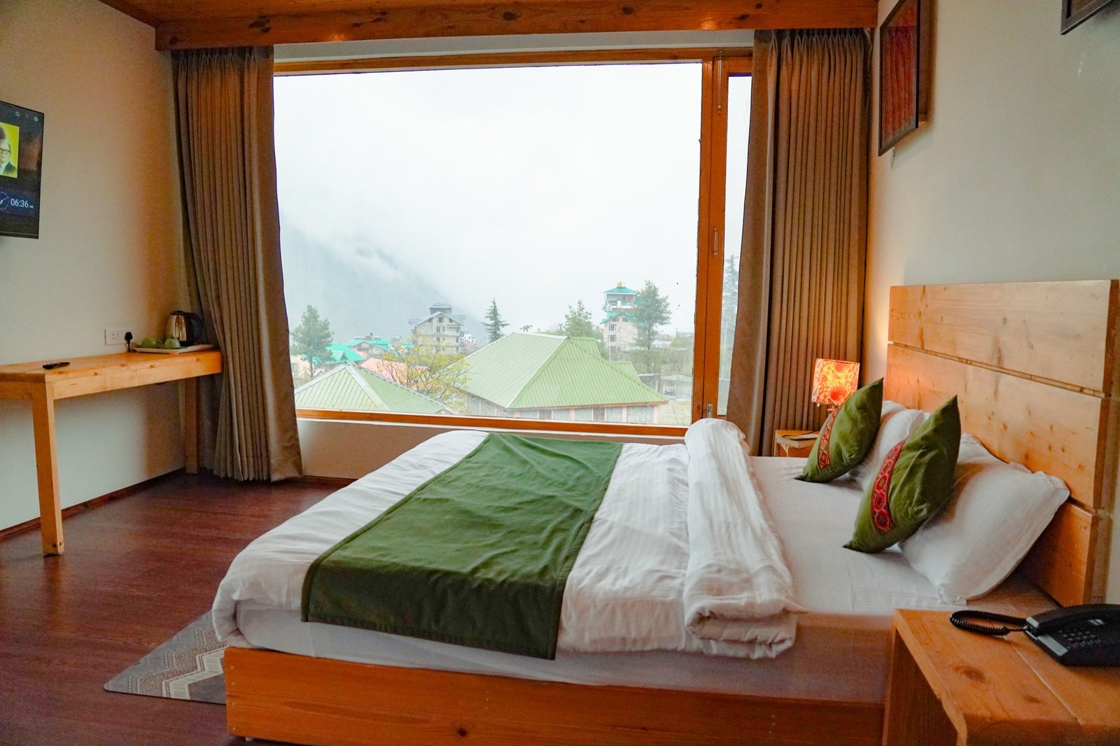 Wide valley window beside the bed