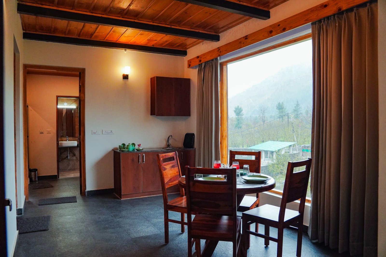 The family villa's living room with kitchenette and dining table